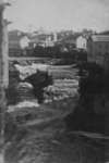 View of the Tooth of Time, Elora, with buildings in the background.