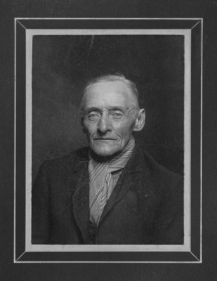 Bust portrait of an unidentified gentleman with a striped scarf.