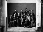 Group portrait of unidentified men with musical instruments.