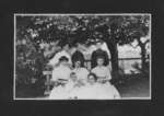 Group portrait of seven women and one young boy.