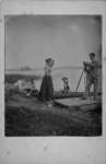 Group portrait of 5 unidentified people, lakeside.