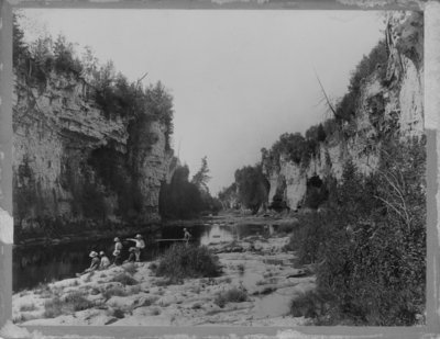 Elora Gorge, with several boys fishing in the foreground.