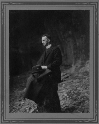 Outdoor portrait of an unidentified Roman Catholic priest.