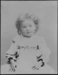 Portrait of a young child, with shoulder length curly hair.