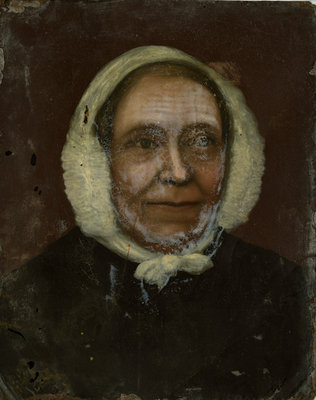 Bust portrait of unidentified woman wearing a dark bodice and white house-bonnet.