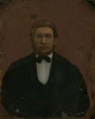 Portrait of unidentified man wearing dark jacket, white shirt and black bow tie