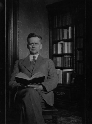 Portrait of an unidentified gentleman, holding an open book.