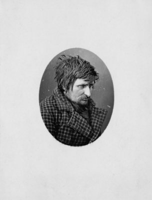 Portrait of an unidentified man in a checked jacket.