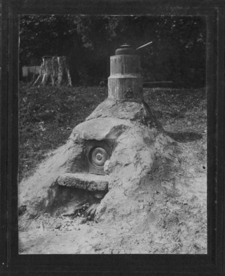 An outdoor structure which may be a clay bake oven.