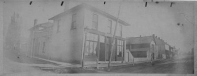 Street view showing storefronts, and buildings, at the corner of Geddes and Moir, Elora.