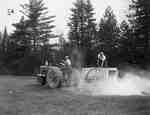 Unidentified Men Spreading Lime with a Tractor and Wagon