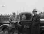 Two men next to truck, Hemlock Park Farms, Kingston ON