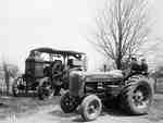 Unidentified Boys Sitting on a Tractor Next to an Oilpull