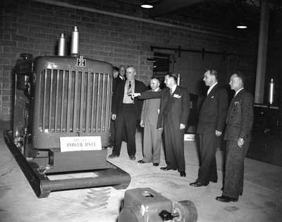 Unidentified Men View Gas Engine Unit, Ottawa, ON