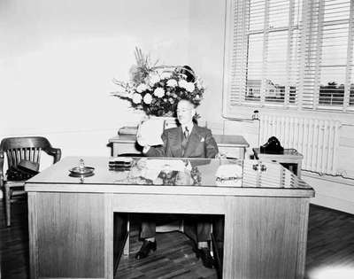 Man Sitting at an Office Desk, Chatham, ON