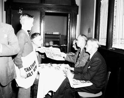 Men Review The Chatham Daily News at Branch Opening, Chatham, ON