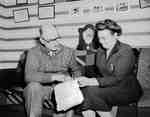 Osborne L. Sager and Unidentified Woman Reviewing Paperwork, Brant County, ON