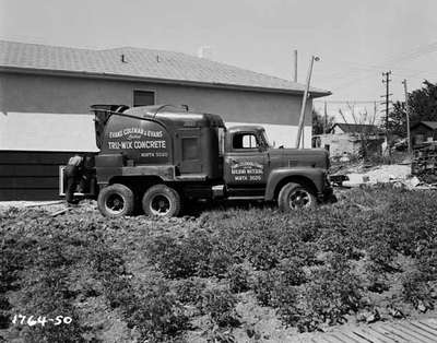 Concrete Mixer Outside of House