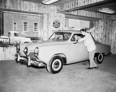 Salesman Robert Grey and Customer at an Automobile Dealership, Burlington, ON.