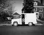 Milk Delivery Truck Parked Outside House