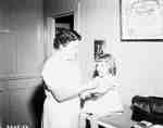 Unidentified Female Nurse & Young Girl