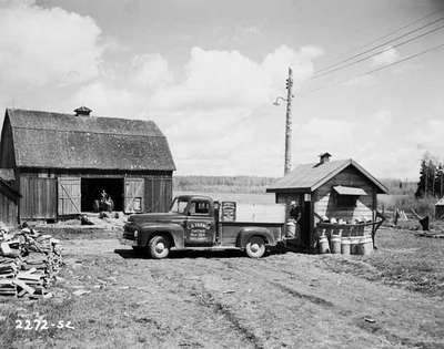 Loading Milk Cans into a Pickup Truck, Englehart, ON