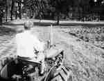 Unidentified Man Driving Tractor
