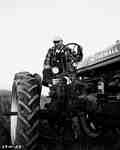 Unidentified Man Sitting on a Tractor