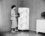 Unidentified Woman Next to Refrigerator