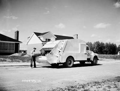 Garbage Man Dumping into a Garbage Truck, Burlington, ON