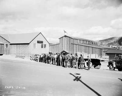 Labourers Lined Up Outside of a Bank, Forestville, QC