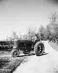 Unidentified Man Driving a Tractor, Guelph, ON