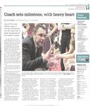 Coach sets milestone, with heavy heart