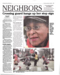 Crossing guard hangs up her stop sign