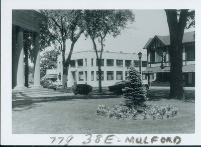 View looking NW showing Wilmette State Bank, Village Hall, Shultz & Nord dry cleaners