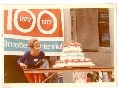 Woman with Centennial cake