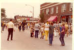 Street scene showing people walking in the street