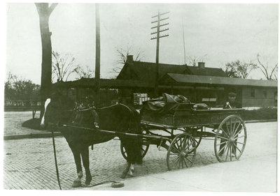 Horse and wagon in front of the Chicago & Northwestern railroad depot