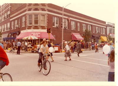 Boy riding a bicycle across the street